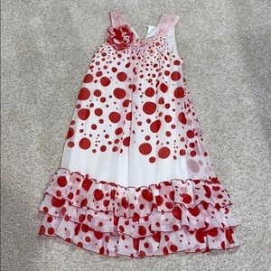 White and red poke a dotted dress